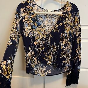 Blue blouse with mustard colored accents. Belle sleeve and knit detail.